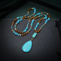 Blue turquoise imitation mineral necklace with large water drop pendant and ball bead chain.