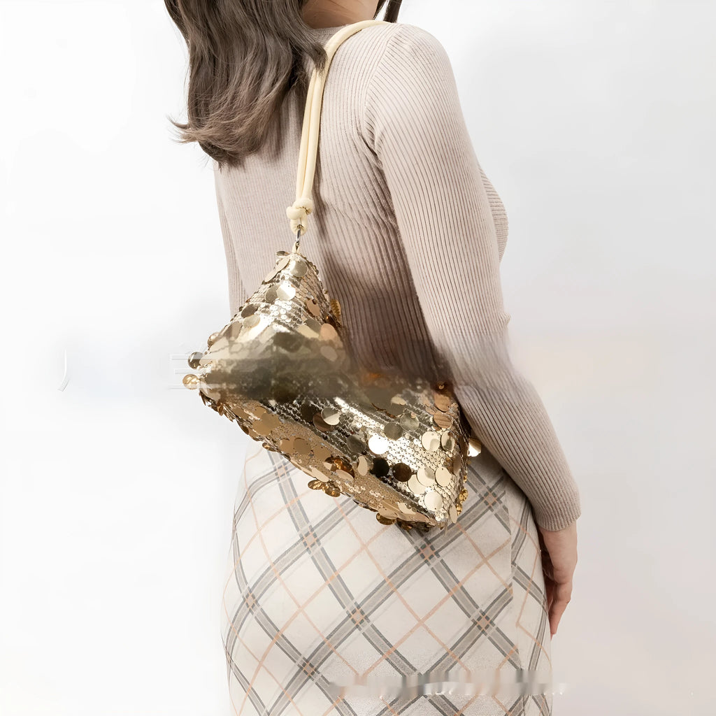 Women's soft polyester underarm crossbody bag in gold colour showing sandwich pocket design and single strap