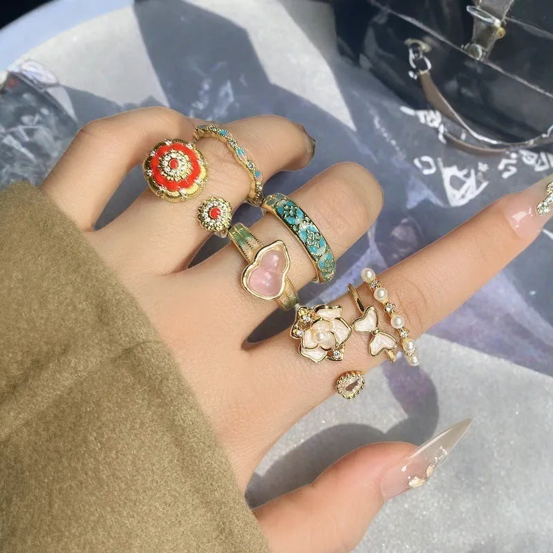 Adjustable copper ring with oil drip finish, featuring a gourd design and inlaid zircon stones.