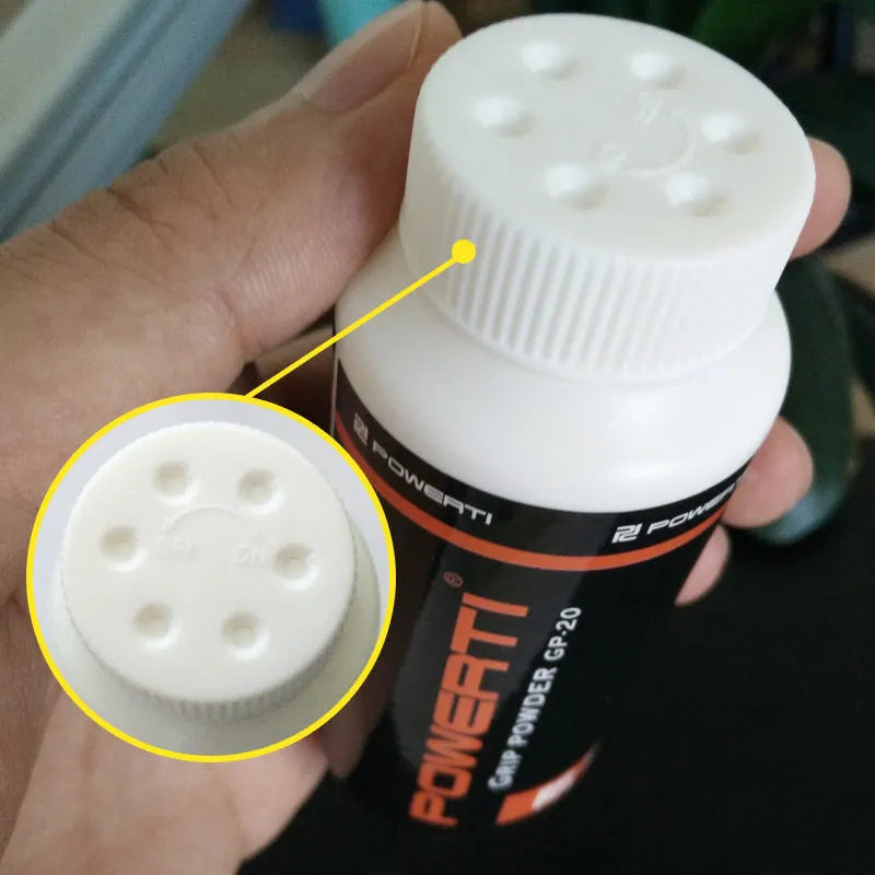 White sports anti-slip magnesium carbonate powder in container for gym and racket sports.