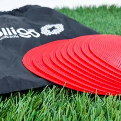 Yellow football training marker disc on grass field showing 23cm diameter flat design