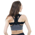 Black adjustable posture correction strap for back and shoulder support.