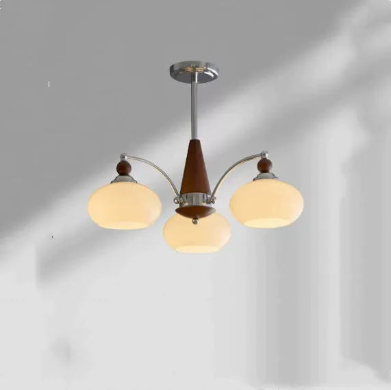 Persimmon glass and chrome chandelier with multiple glass lampshades in a choice of colours.