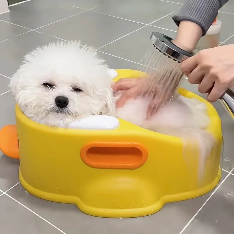 Blue PVC duck-shaped bathtub for washing a dog or cat