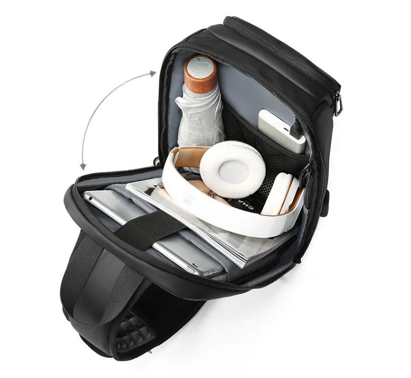 Black medium-sized PVC shoulder bag showing front zipper, air cushion strap, and internal laptop pocket.