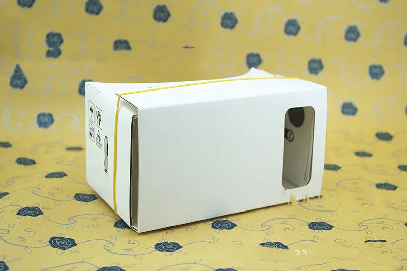 Pink and white VR cardboard glasses for 6-inch smartphones with adjustable head strap.