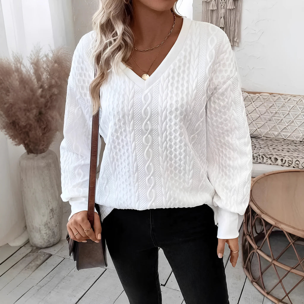 Milky white loose long sleeve T-shirt with a textured 3D pattern on the front.