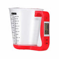 Green digital kitchen scale measuring cup with LCD display in handle on kitchen counter