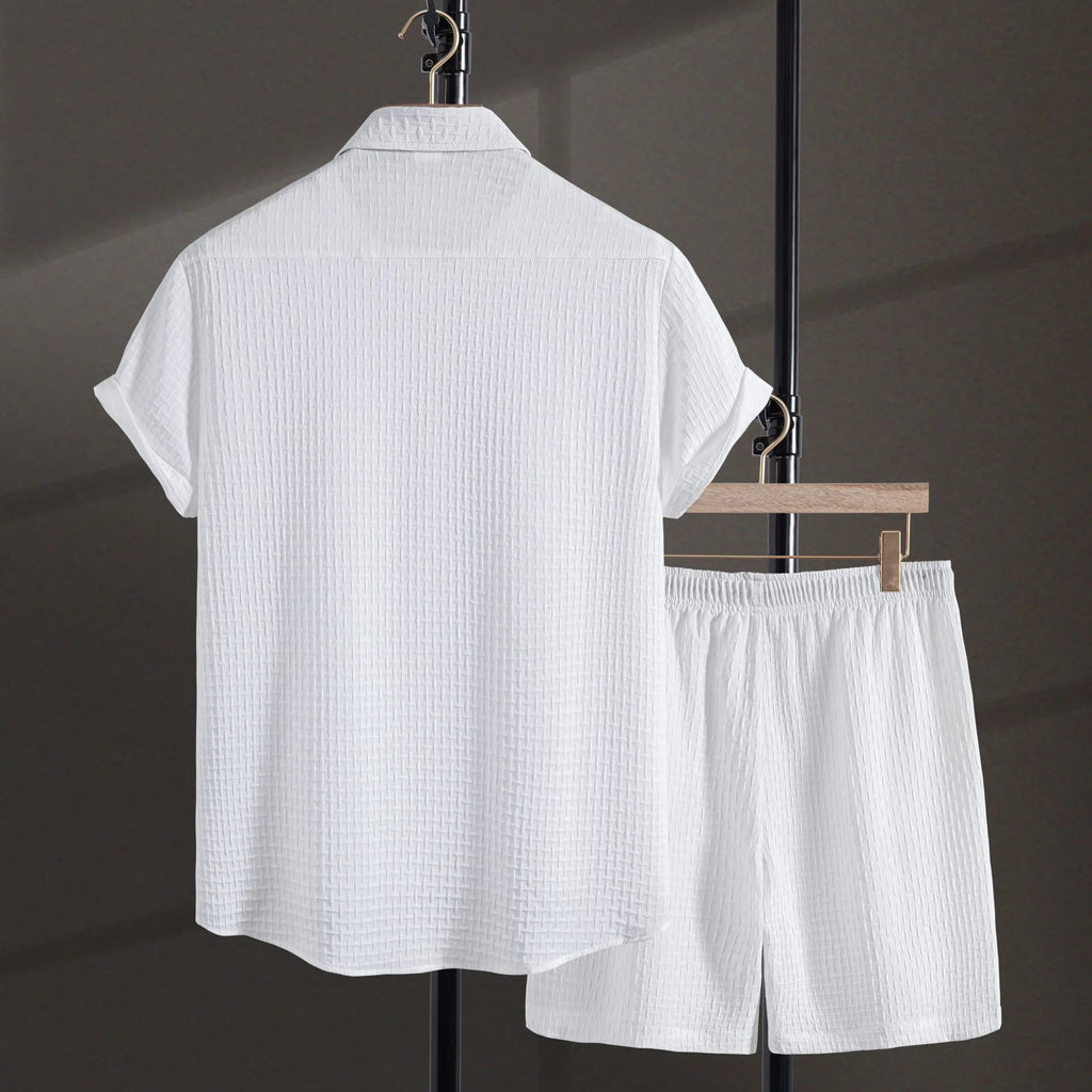 Men's black cotton blend beach suit with loose cardigan shirt and matching shorts.