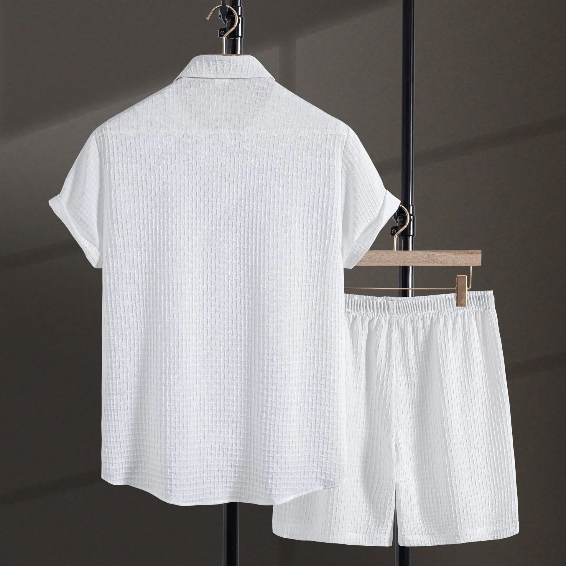Men's black cotton blend beach suit with loose cardigan shirt and matching shorts.