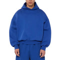 A man's solid-colour fleece-lined cotton hoodie with a wool interior, shown in a casual setting.