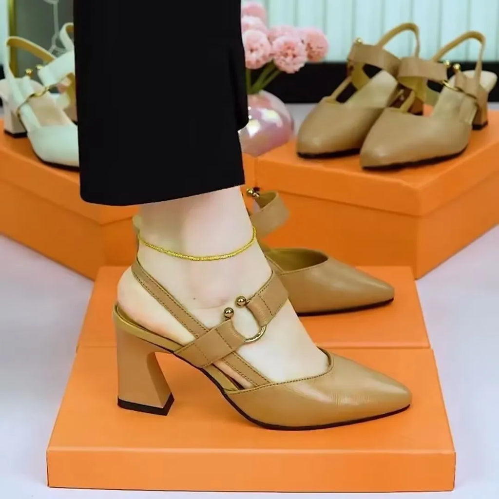 Women's black leather closed toe sandals with a chunky high heel on a white background.