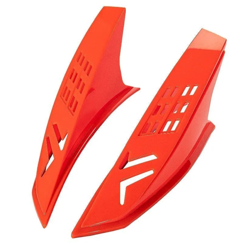 A pair of black plastic decorative horns for children's helmets with visible 3M adhesive backing.