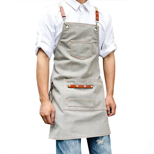 Canvas apron with cross-back straps in camel colour
