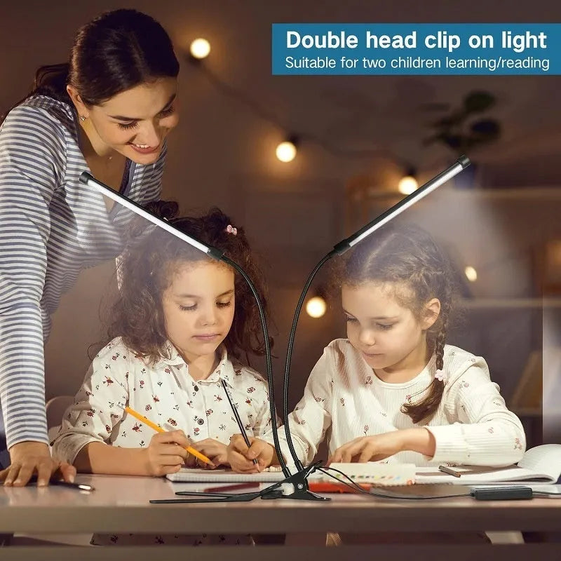 Black and white USB-powered LED desk lamp with flexible 26 cm gooseneck neck on a desk.