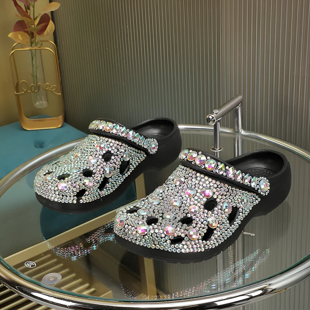 Black platform sandals for women with rhinestone detail and open-hole design on a lightweight EVA sole.