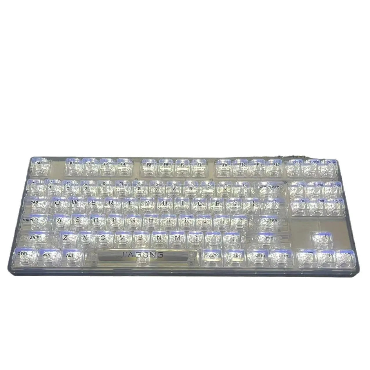 Universal transparent plastic 132-key keyboard key cap set laid out on a table.