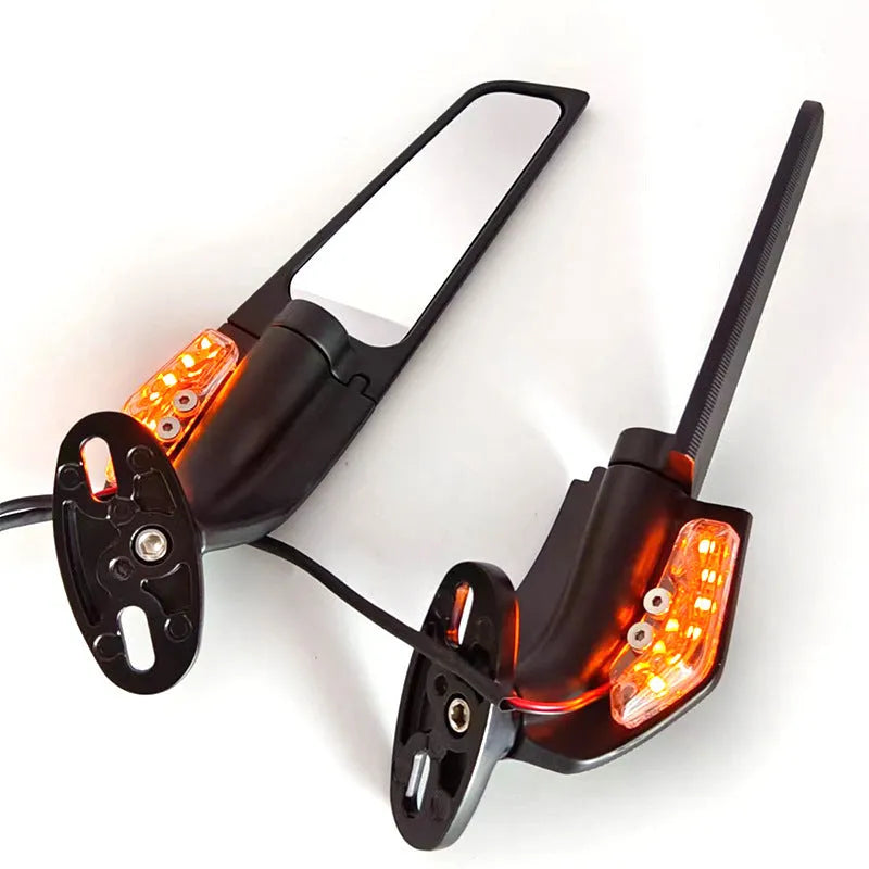 Pair of yellow motorcycle rearview mirrors with integrated running reflectors, showing convex glass lens and aluminium housing.