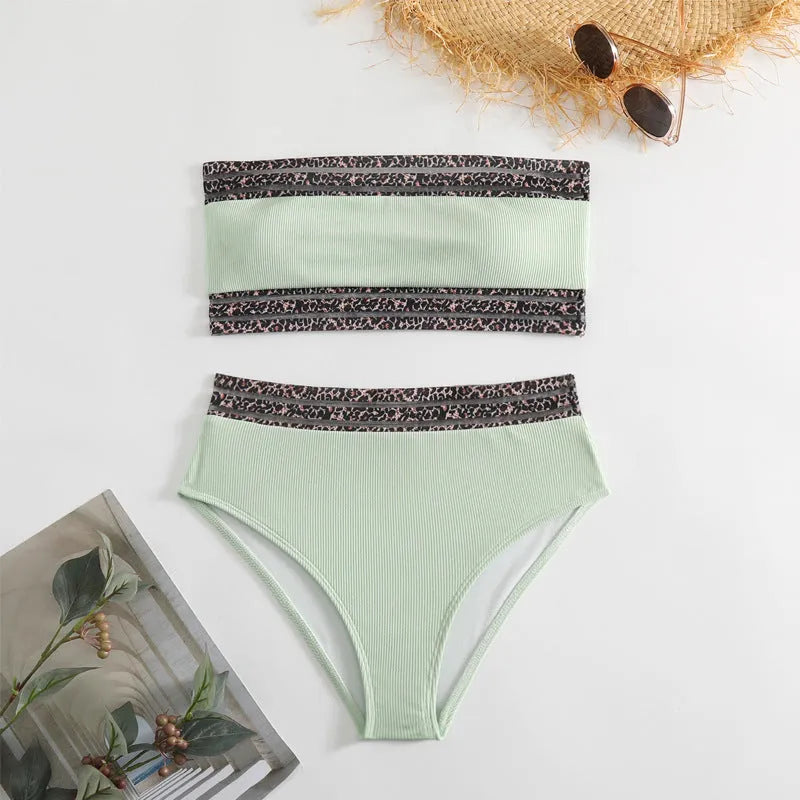 Black leopard print strapless swimsuit with two-piece design on mannequin