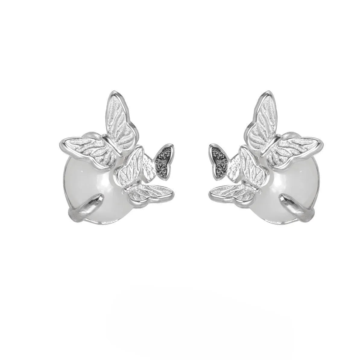 A pair of butterfly-shaped stud earrings in sterling silver with gold colour finish.