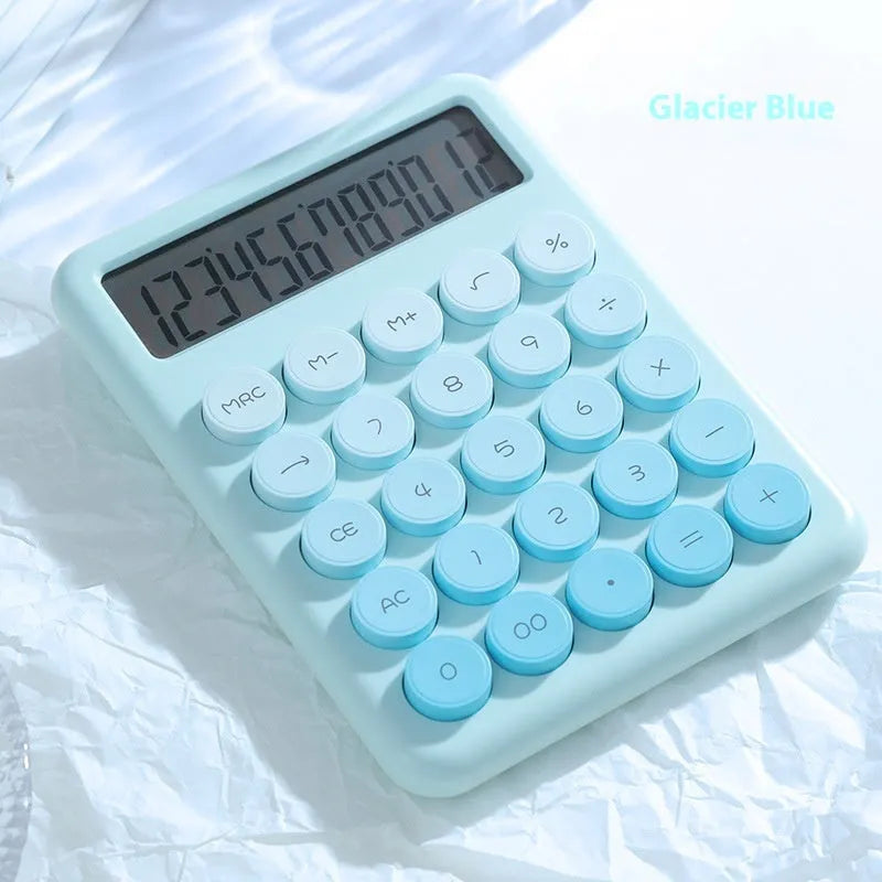 Gradient colour desktop calculator in violet, pink, blue, and green shades on a desk.