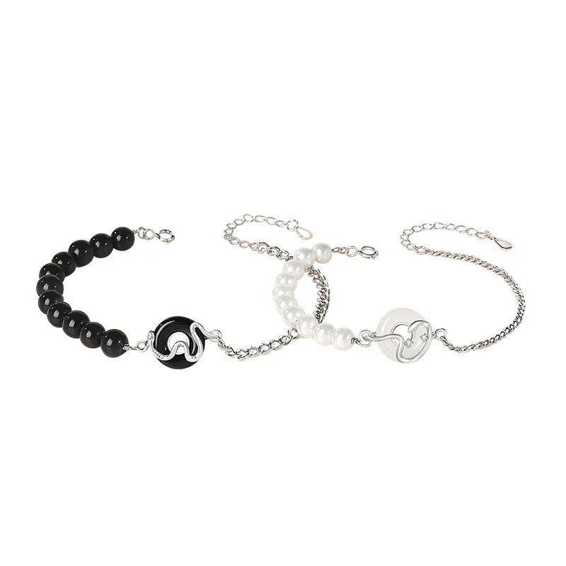 A new Chinese style 925 sterling silver bracelet with an obsidian pearl, snake zodiac charm, and a safe buckle clasp.