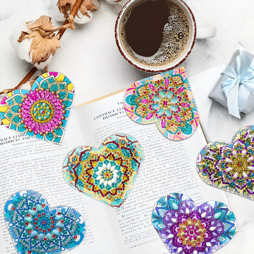 Six handmade PU leather bookmarks with crystal flower cornerite designs on a surface.