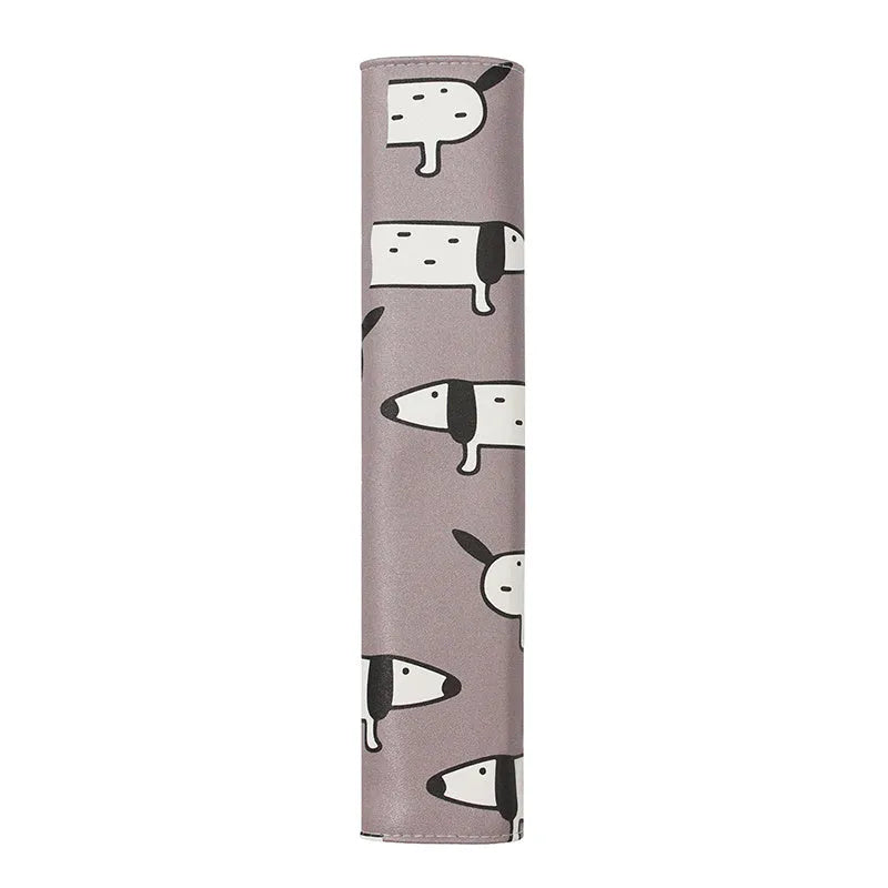 Cute Dachshund cartoon design on a black PU leather car seat belt shoulder protector sleeve.