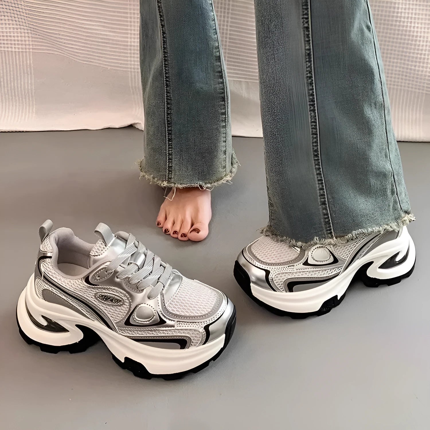 Women's silver and red mesh breathable clunky platform sneakers with a rubber sole.