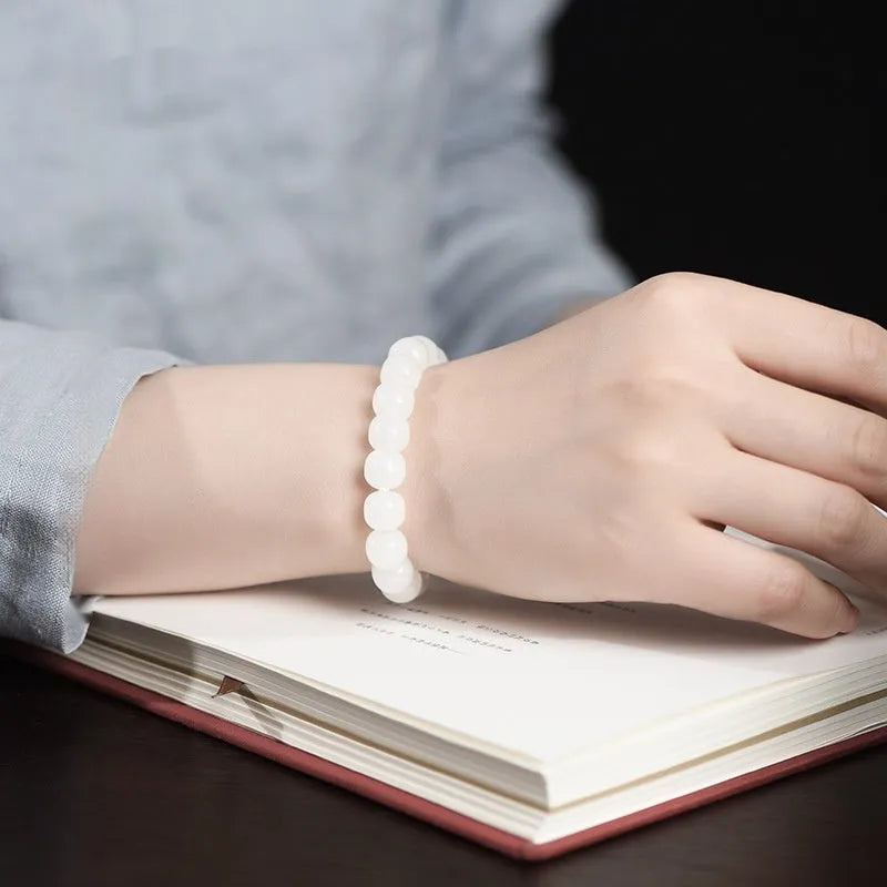 White Hetian jade barrel bead bracelet for men and women shown in three bead size options.