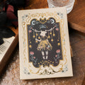 THALO Gothic style A5 retro art notebook showing one of three cover colour options: rabbit maze, forest, or red fruit design.