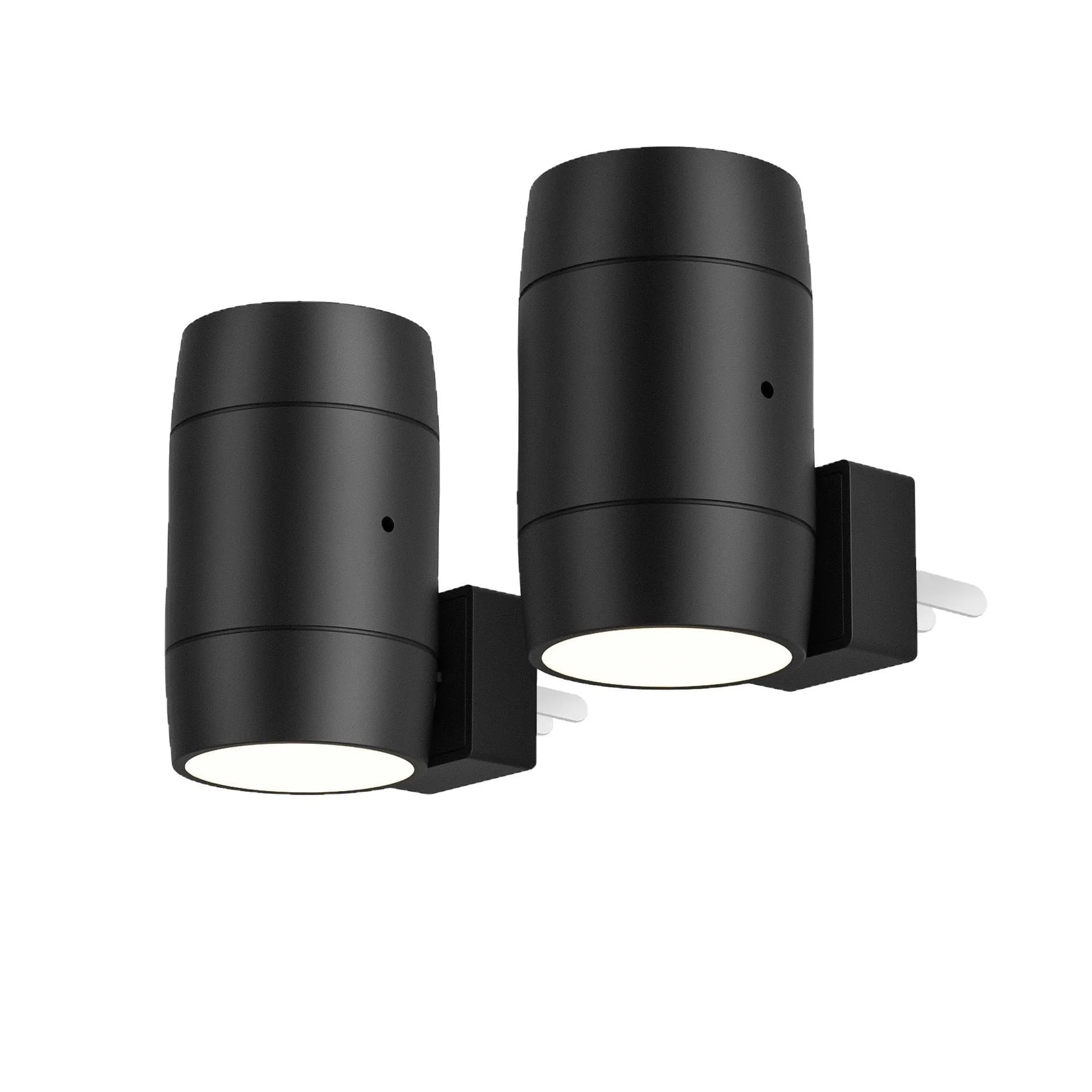 A small white plug-in night light with an adjustable head, shown next to a power socket for scale.