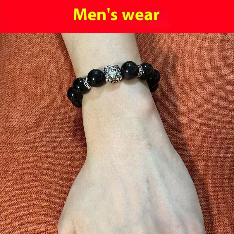 Obsidian bracelet with silver 999 settings showing natural cloud patterns in the beads