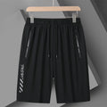 Men's black quick-dry loose-fit nylon sports shorts on a size chart background