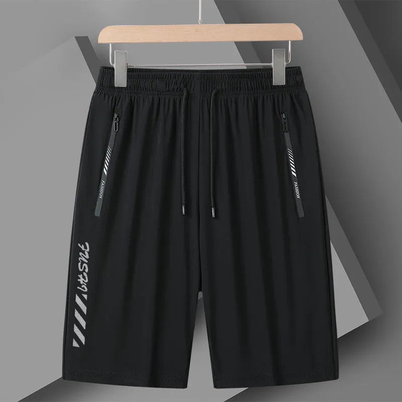 Men's black quick-dry loose-fit nylon sports shorts on a size chart background