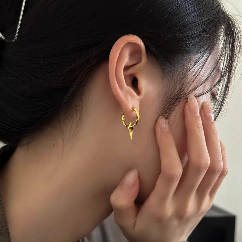 Platinum coloured geometric star shaped ear clips for women with a white gold plated finish