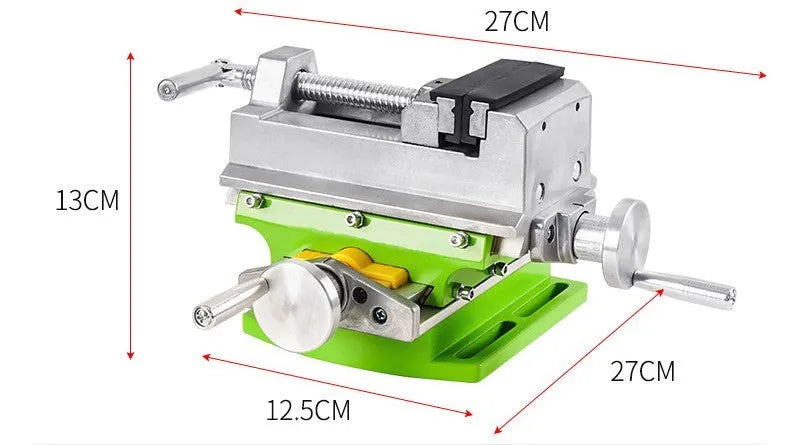 Mini bench drill and milling machine with heavy duty bench pliers on a workbench.