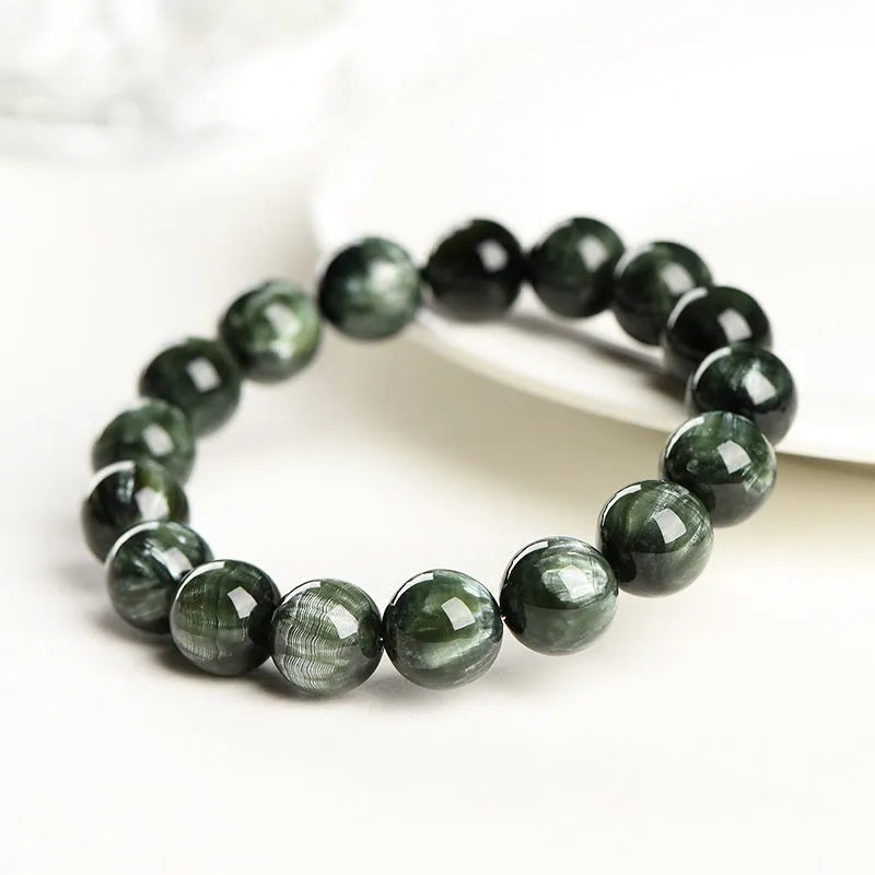 Natural Green Dragon Crystal round bead bracelet with 8-9mm beads and a Ruyi charm.