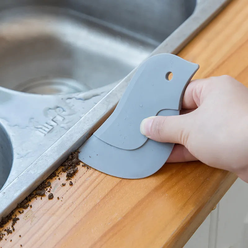 Penguin-shaped soft kitchen scraper for cleaning plates and removing food stains