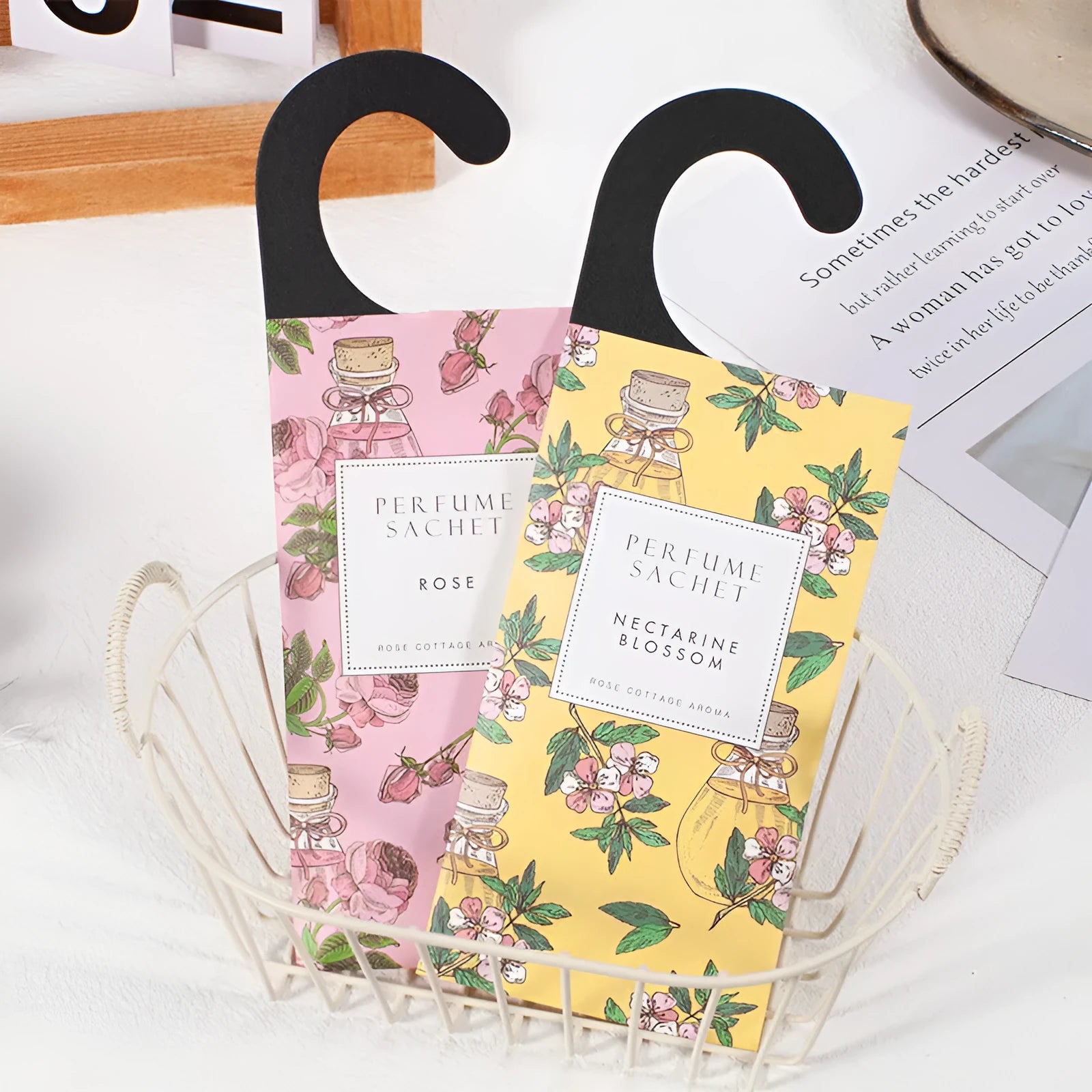 Pack of five household wardrobe sachets with lavender, rose, jasmine, sandalwood, vanilla, apricot blossom aromas on a shelf