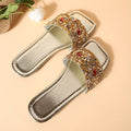 Gold women's flat slippers with rhinestone sequin decoration on the upper.