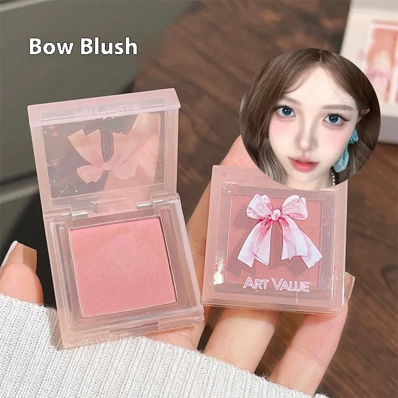 Butterfly Box Suite makeup set showing four matte lip muds, powder blusher, and coordinating necklace