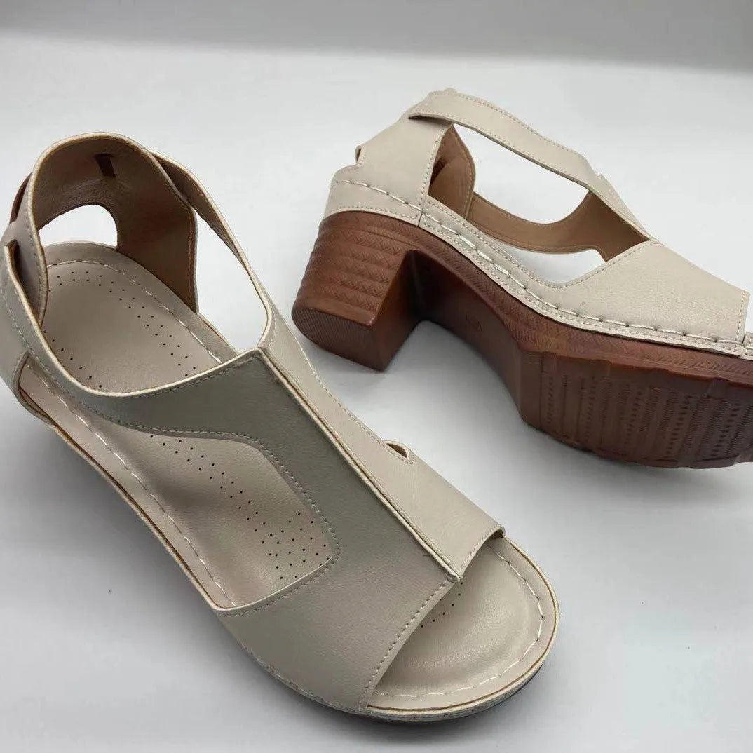 Women's peep toe wedge sandal with buckle on low heel, open fish mouth toe, in light brown