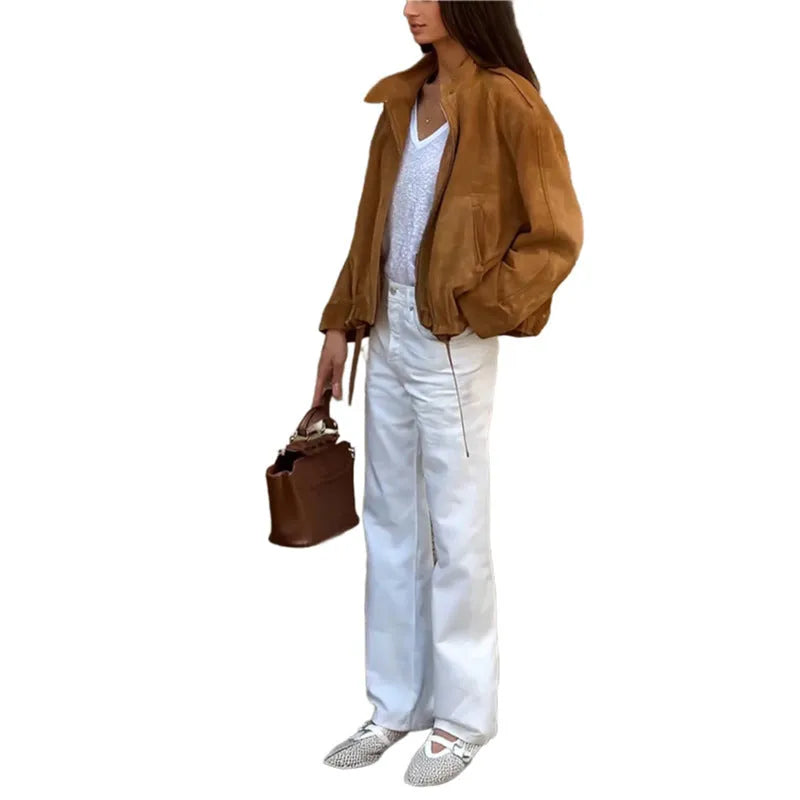Man wearing a solid colour loose-fit retro polyester jacket with long sleeves.