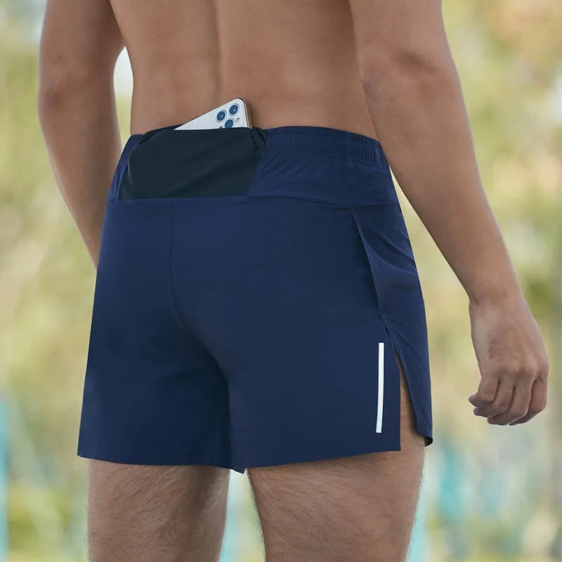 Men's red off-road running shorts with a high waist and loose fit, shown on a model.