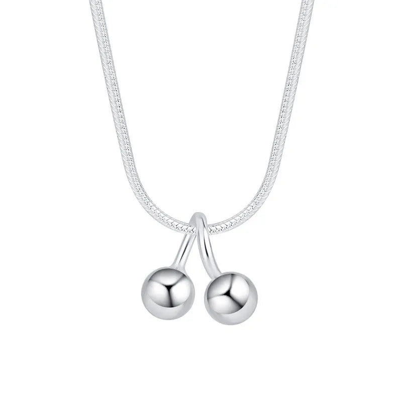 Silver cherry necklace for women on a snake bone chain, adjustable length.