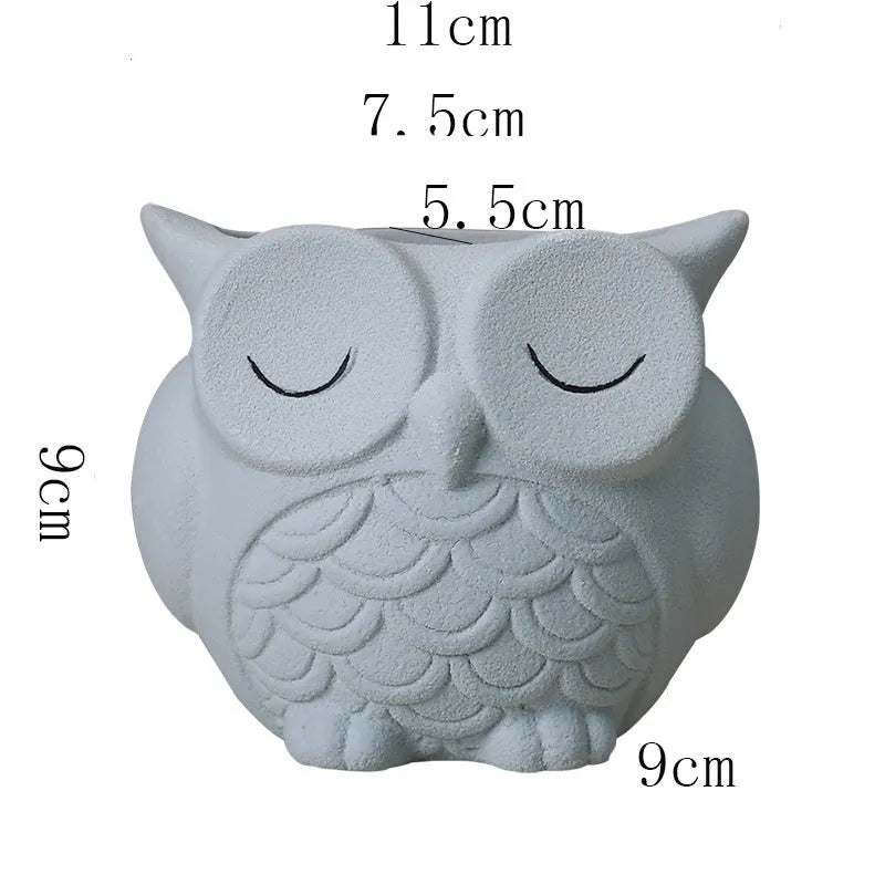 Handmade frosted owl ceramic succulent pot in light pink, showing cartoon design and 11cm size.