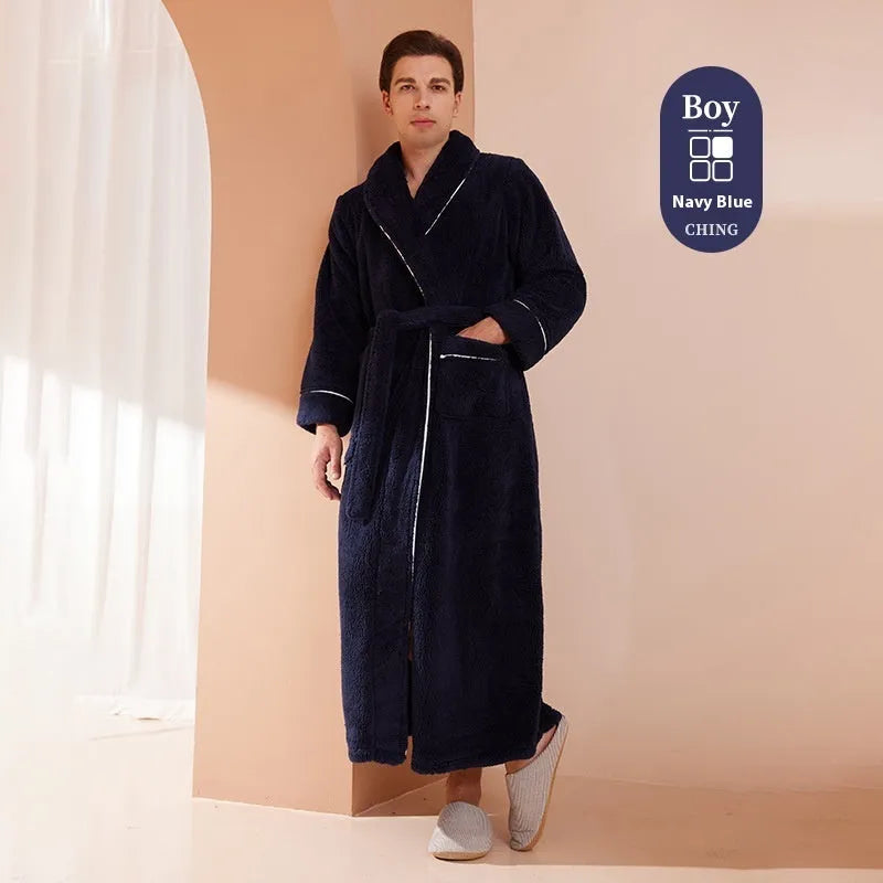A man and woman wearing matching thick, navy blue flannel bathrobes in a European style cut.