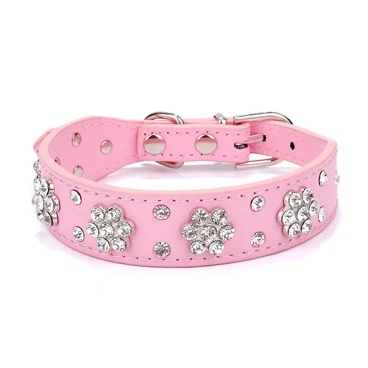 Black PU leather dog collar with rhinestone flower pattern and studs, adjustable for small dogs.