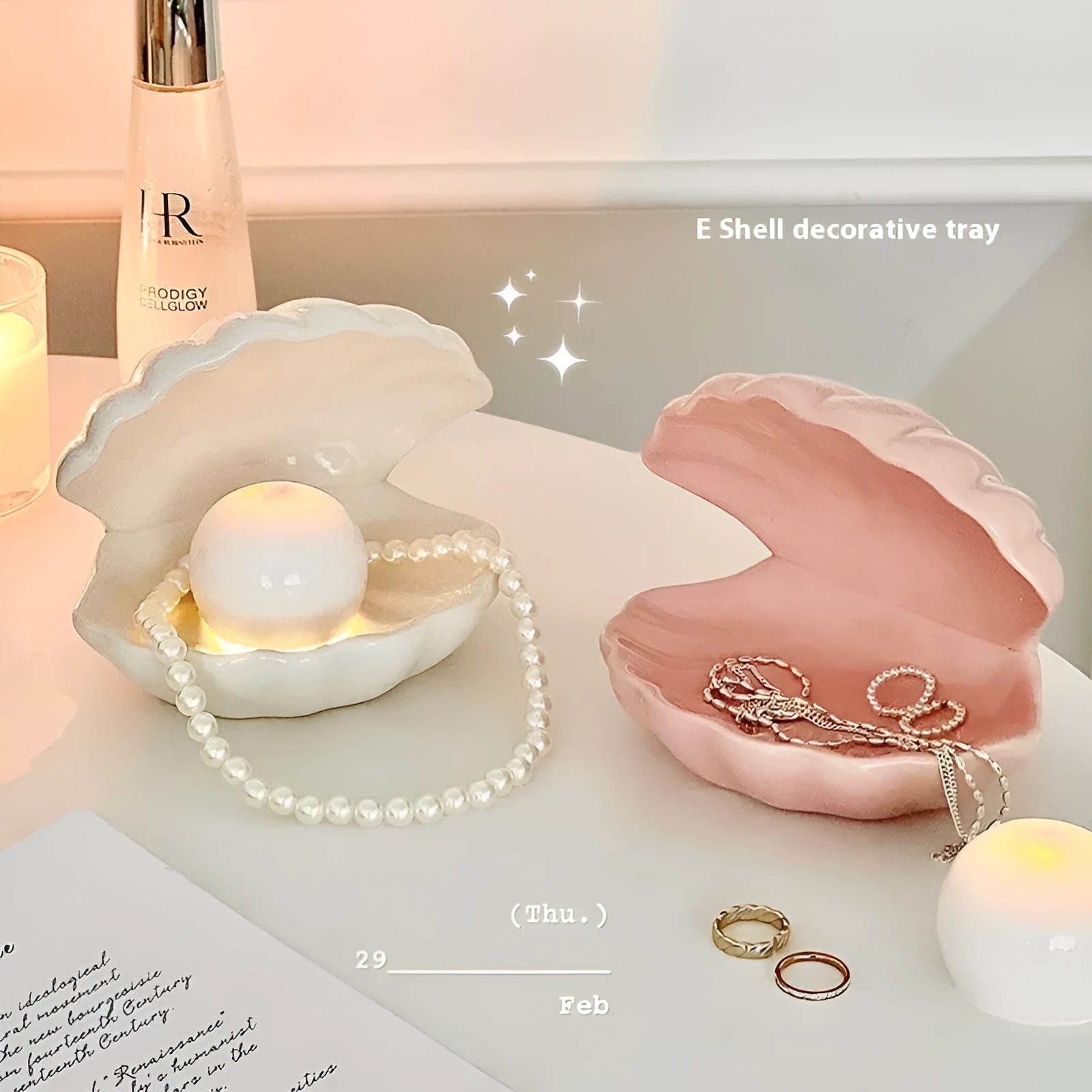 White porcelain storage tray with optional small night light, shown in pink and white shell colours on a wooden surface.